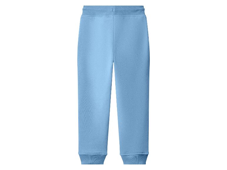 Pantalon de survêtement bleu clair avec taille et chevilles élastiques.