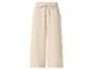 Pantalon large beige avec taille élastique et cordon de serrage.