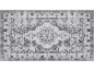 Tapis gris avec un motif classique, délavé et un médaillon central.