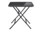 Petite table pliante noire avec plateau en verre.
