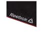 Soutien-gorge de sport Reebok noir avec une bordure rouge.