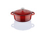 Une cocotte en fonte rouge avec un couvercle.