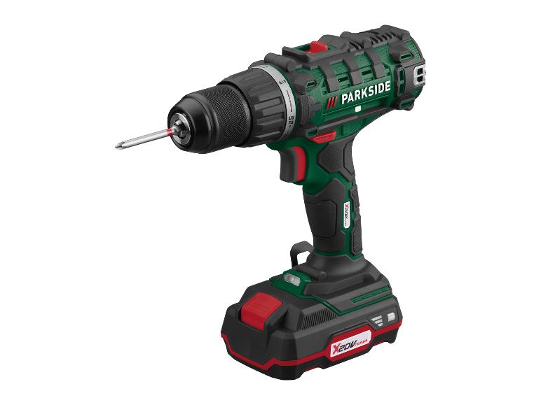 Une visseuse-perceuse Parkside verte et noire avec batterie X20V TEAM.