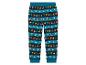 Un pantalon de pyjama de Noël bleu avec des rennes, des pères Noël et des bonhommes en pain d'épices.