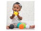 Bébé jouant avec des balles sensorielles et jouets à textures.