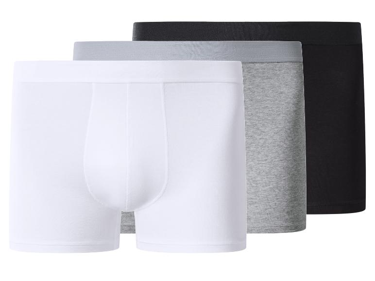 Trois boxers en blanc, gris et noir