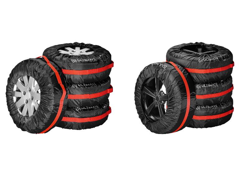 Deux piles de pneus avec housses noires et sangles rouges, logo Ultimate Speed.