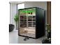 Sauna infrarouge moderne dans une salle de bain, avec éclairage vert et intérieur en bois.