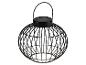 Lanterne solaire noire sphérique avec un design en fil de fer et une poignée.