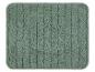 Un tapis de bain de couleur vert clair avec un motif côtelé.