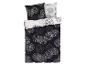 Une parure de lit avec un motif circulaire noir et blanc.