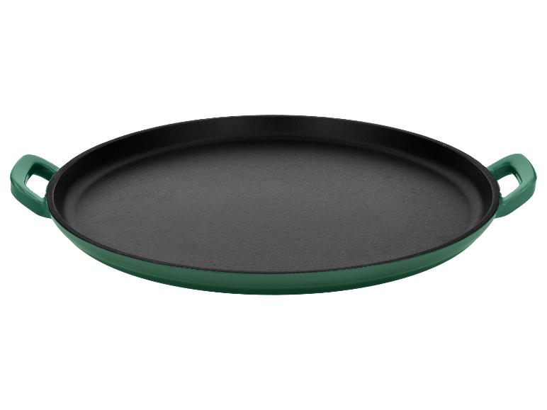 Poêle à paella en fonte émaillée verte avec intérieur noir.