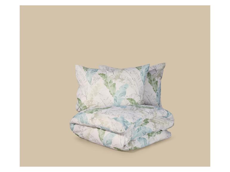 Parure de lit avec motif de feuilles tropicales dans des tons verts et bleus.