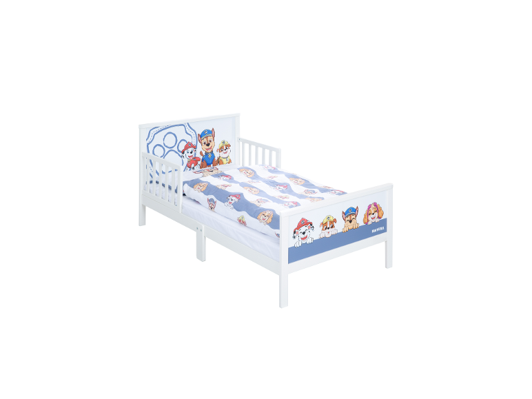Lit pour enfant blanc avec des personnages de chiens de dessin animé et un motif de patte bleue.