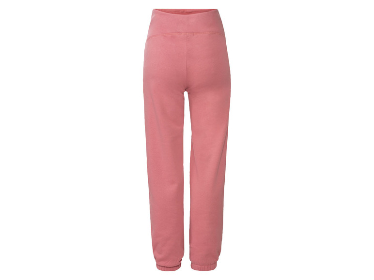 Pantalon de survêtement rose avec taille élastique.