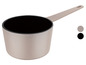 Une casserole beige avec un intérieur noir.