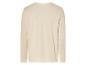Un t-shirt à manches longues beige clair.