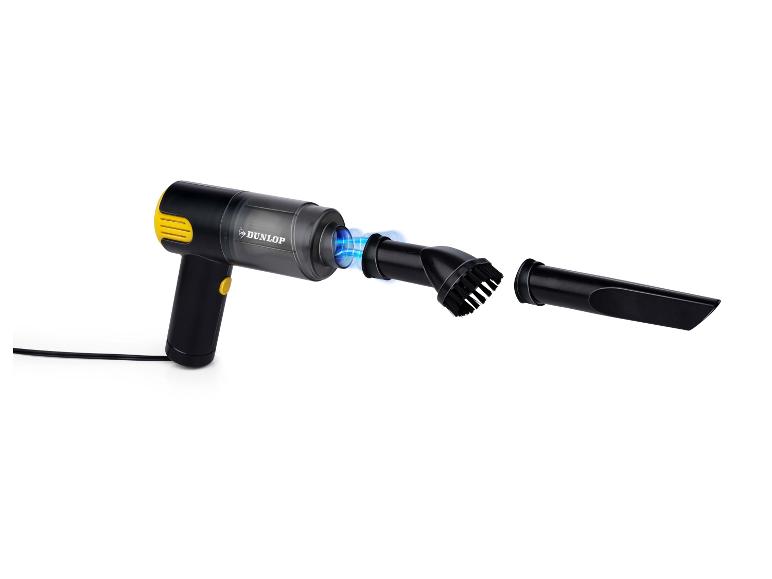 Aspirateur à main noir et jaune avec deux accessoires et effet de lumière bleue