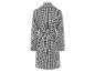 Un manteau noir et blanc à carreaux avec une ceinture.