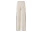 Pantalon large beige avec taille élastique.