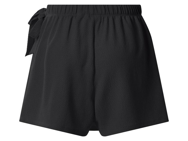 Short noir avec taille élastique et nœud décoratif.