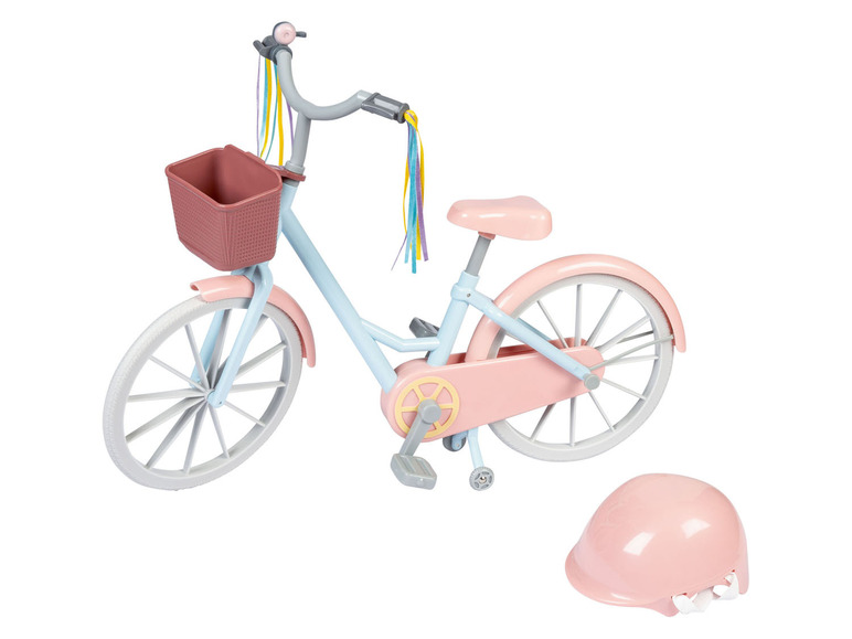 Un vélo rose pour enfant avec un panier et un casque.