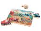 Puzzle en bois avec des moyens de transport: train, voiture, bateau, hélicoptère et moto.