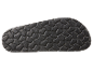 Semelle de sandale noire en caoutchouc avec motif texturé.