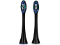 Deux têtes de brosse à dents électriques noires avec des poils bleus, blancs et verts.