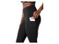 Legging de sport noir avec poche latérale et smartphone, porté par une femme.