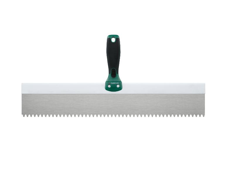 Spatule crantée pour colle à carrelage avec manche vert et noir