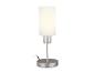 Une lampe de table argentée avec un abat-jour en verre blanc.