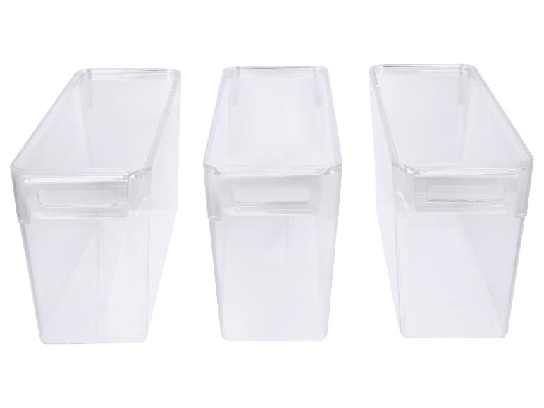 Trois conteneurs de rangement en plastique transparent avec poignées, vus de dessus.