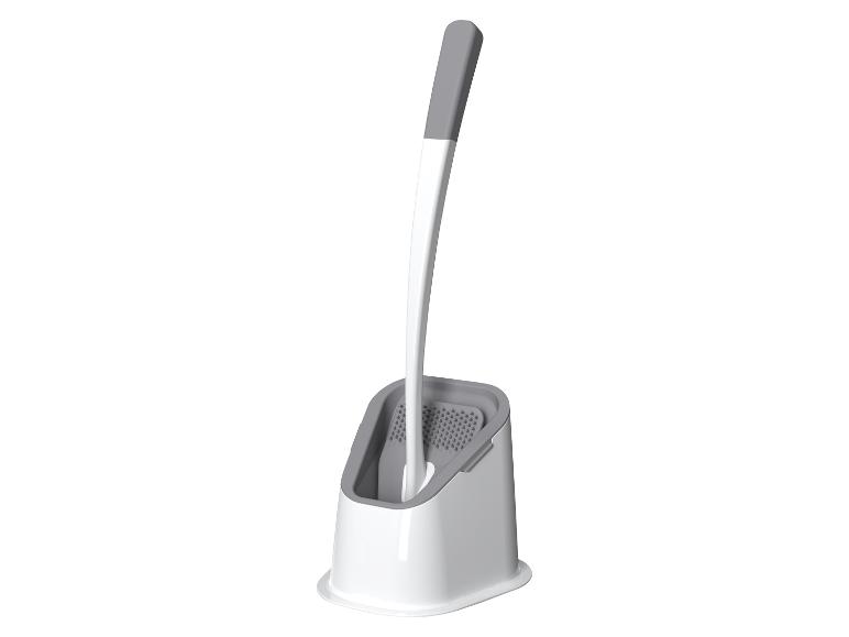 Brosse de toilette et support, design moderne, couleurs gris et blanc.
