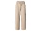 Pantalon de jogging large beige avec cordon de serrage à la taille.