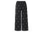 Pantalon large noir à motif feuilles.