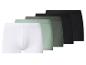 Cinq paires de boxers pour hommes en blanc, vert clair, vert foncé et noir.