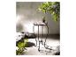 Table basse ronde en mosaïque et métal noir, style jardin.