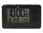 Un réveil radio numérique noir avec affichage de la température.