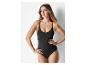 Combinaison et body noirs, style minimaliste.