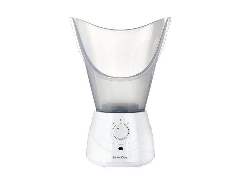 Un vaporisateur facial SilverCrest blanc avec un masque transparent.