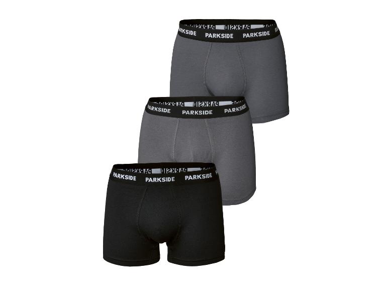 Trois paires de boxers pour hommes en noir et deux nuances de gris.