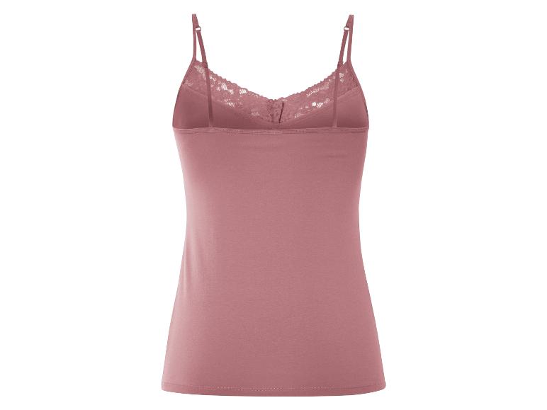 Un débardeur rose avec des détails en dentelle.