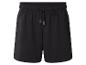 Short de sport noir avec cordon de serrage réglable à la taille.