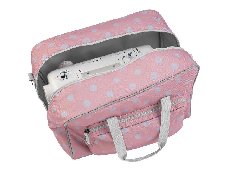 Sac rose à pois pour machine à coudre avec une machine à coudre à l'intérieur