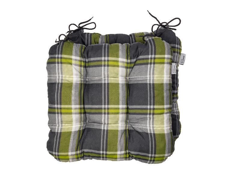 Coussin de siège Livarno Home à carreaux verts, gris et blancs avec des attaches noires.