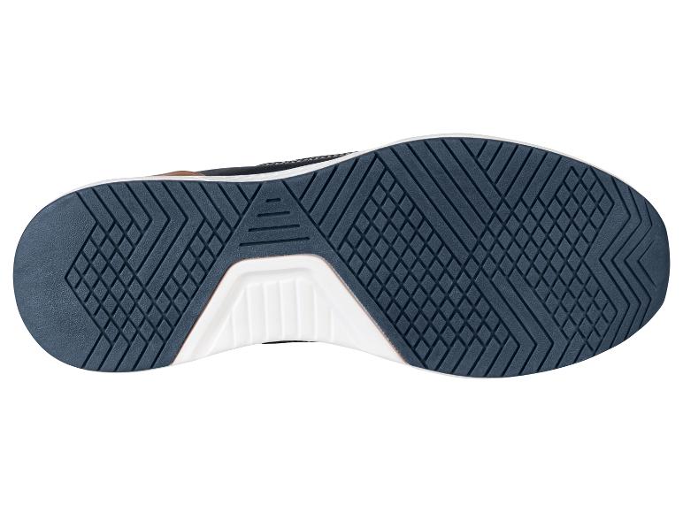 Semelle d'une chaussure de sport bleu foncé.