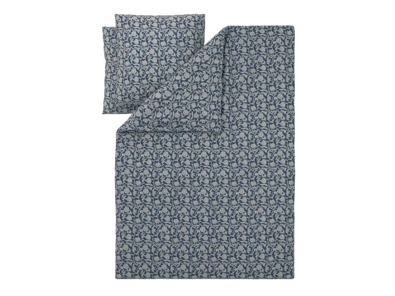 Parure de lit housse de couette et taies d'oreiller à imprimé floral bleu et gris.