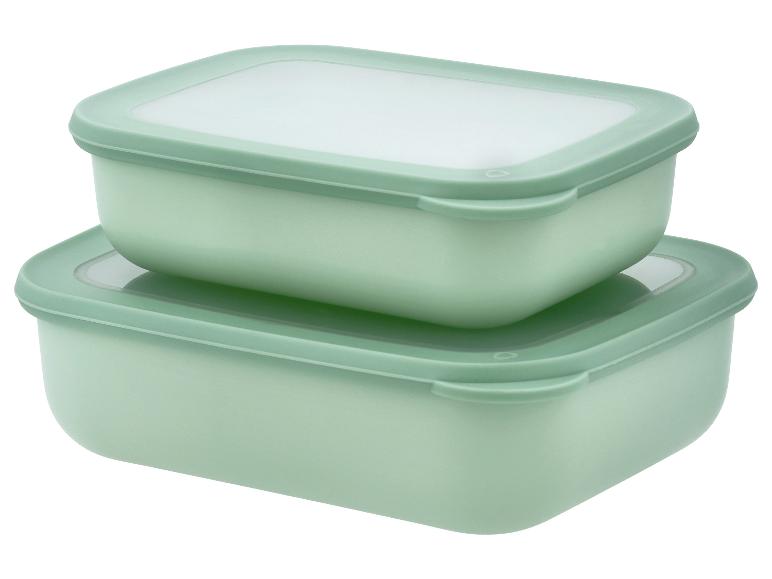 Deux boîtes de conservation rectangulaires vert menthe, empilées l'une sur l'autre.