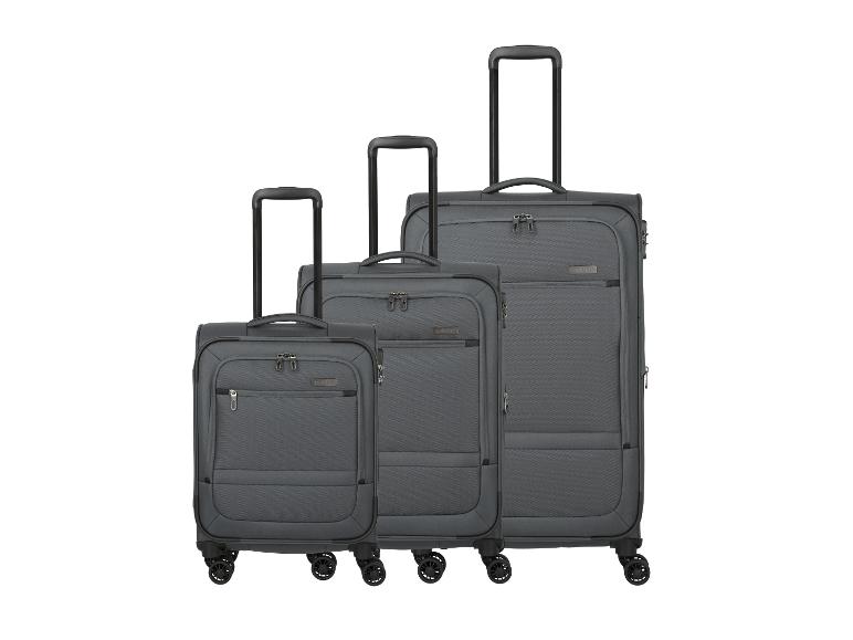 Ensemble de trois valises de voyage grises de tailles variées.